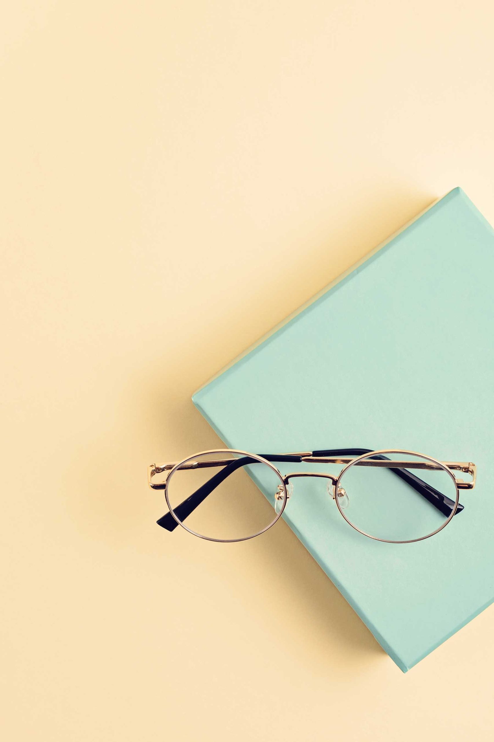 stylish-eyeglasses-over-pastel-background-optical-2021-06-24-17-12-46-utc.jpg