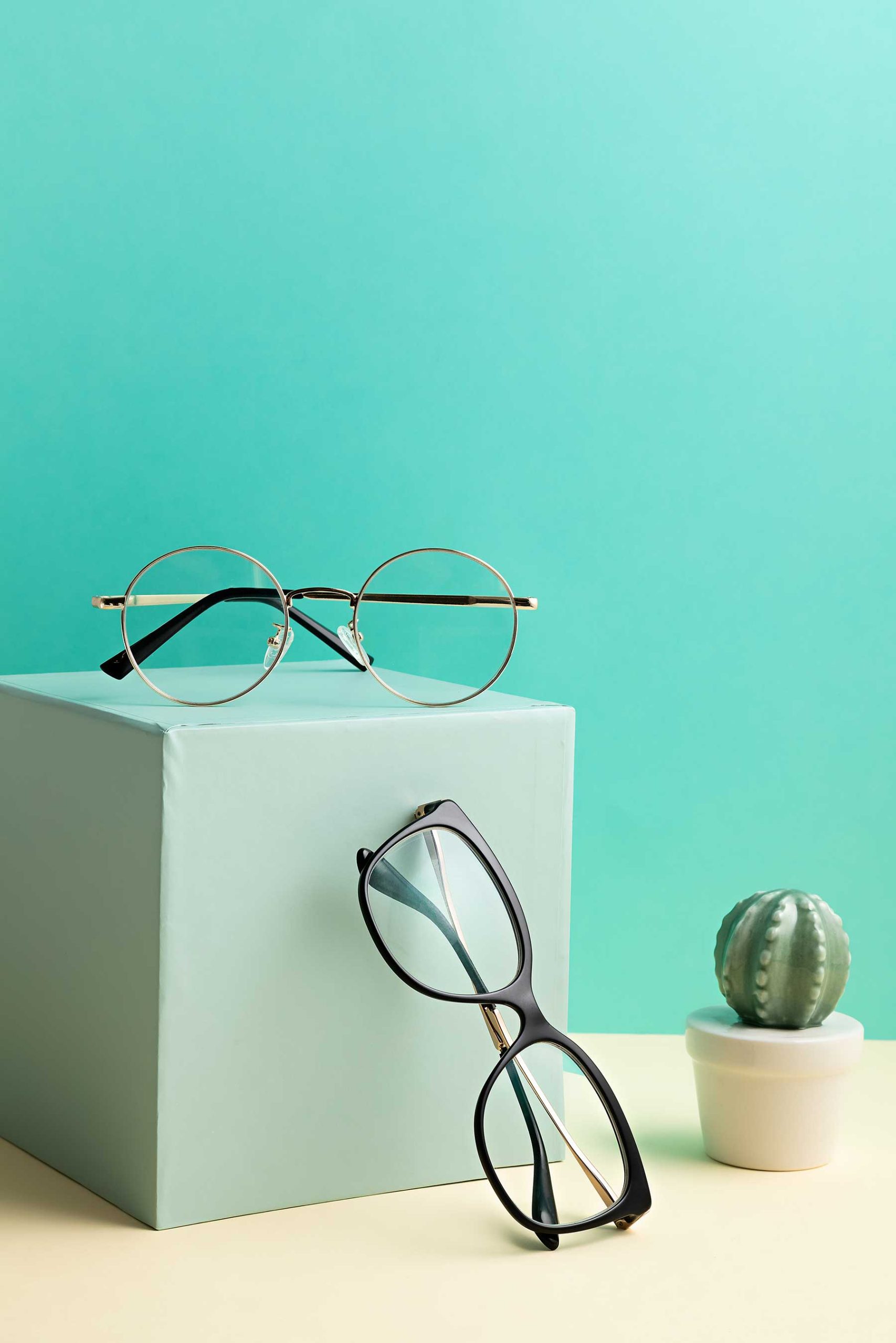 stylish-eyeglasses-over-pastel-background-optical-NFEVVE5.jpg
